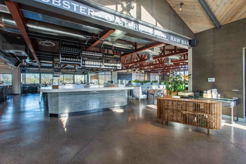 The interior of a restaurant with wooden flooring.