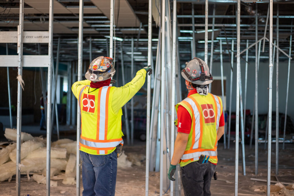 Electricians collaborating